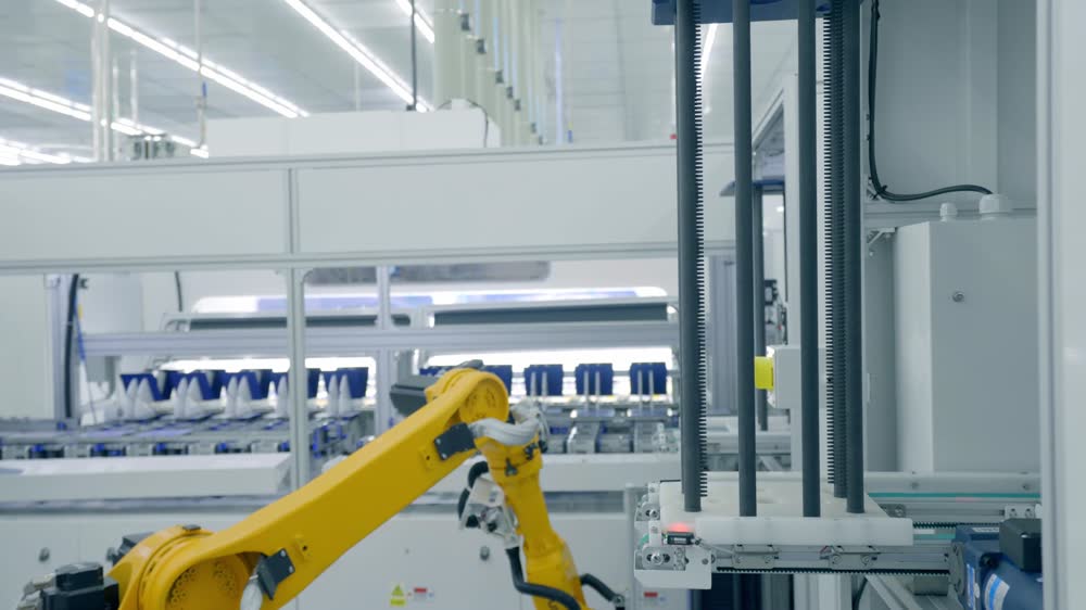Robot de transfert entre deux postes.